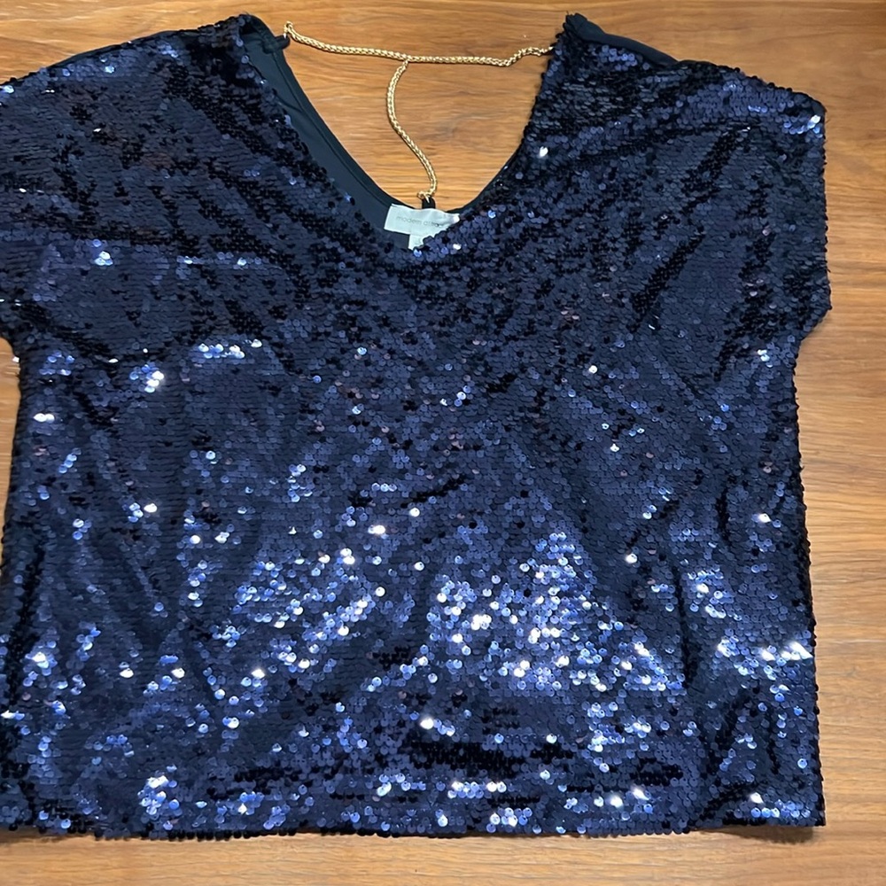 Sequin top with chain detail in the back. Size L